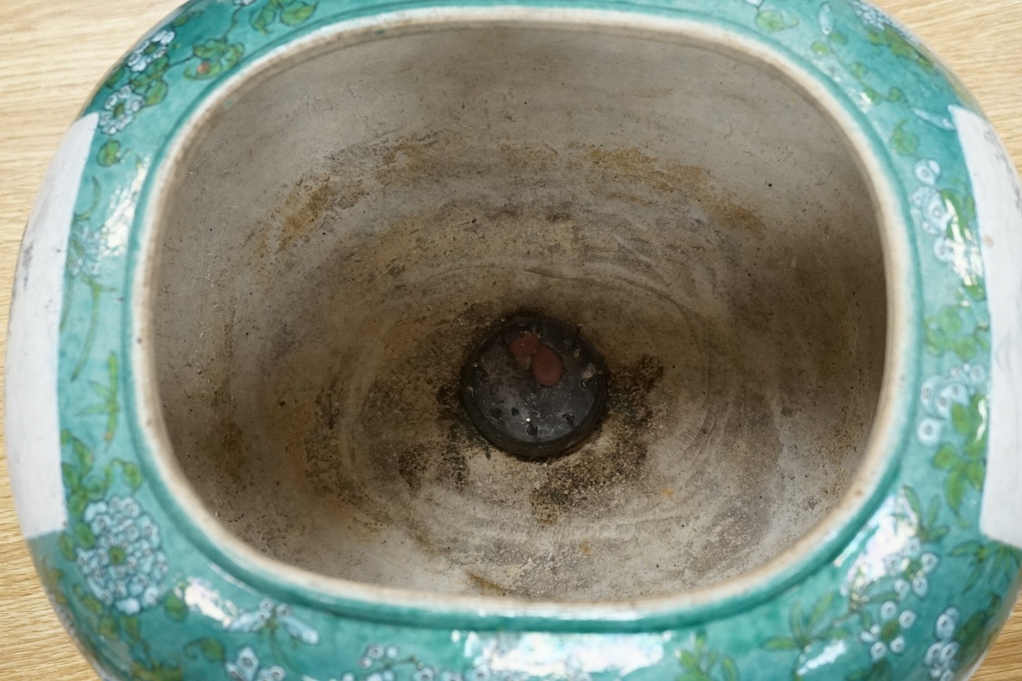 A Chinese enamelled porcelain oval bowl, Guandong kilns, early 20th century, green with en grisaille panels, 20cm high